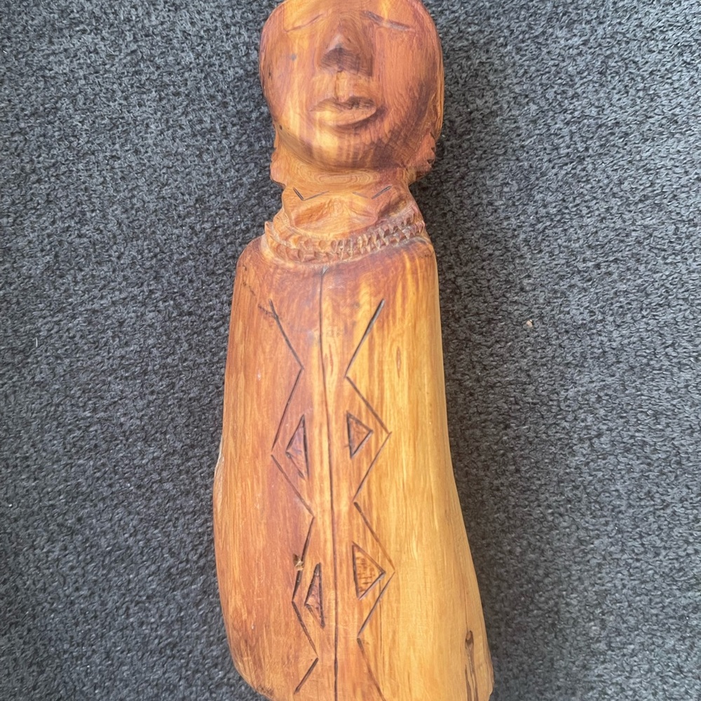 Stylized Brown Wooden Sculpture with Intricate Carvings